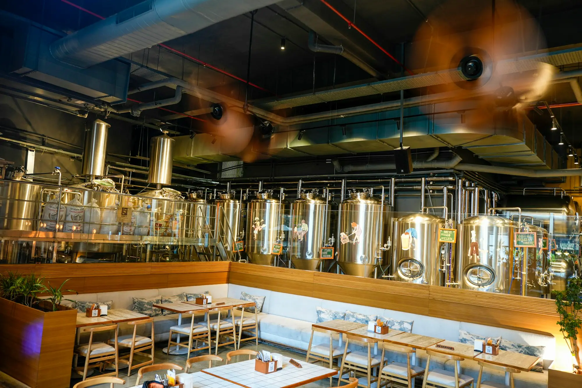 A brewery taproom with steel tanks, a business working out how much it can borrow