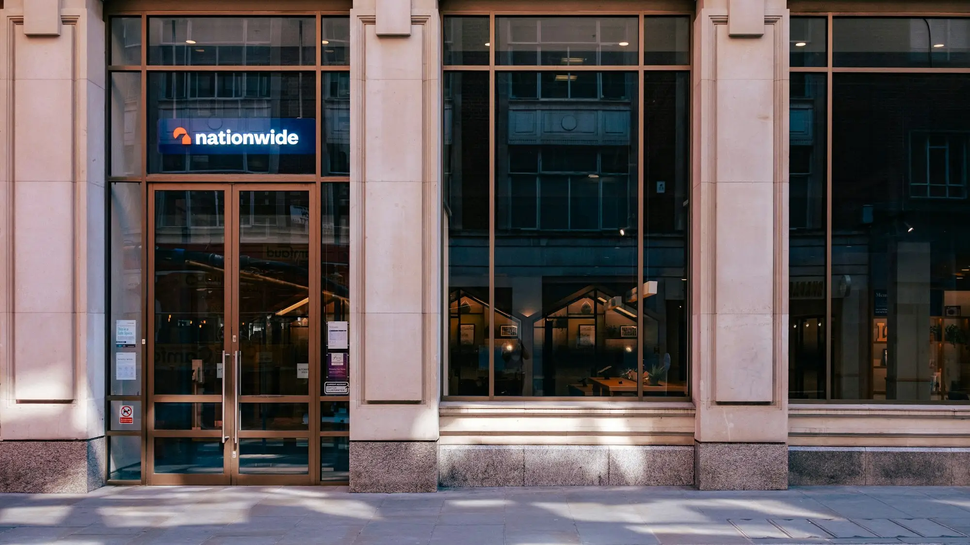 A commercial building entrance with large windows, property that can secure a large loan
