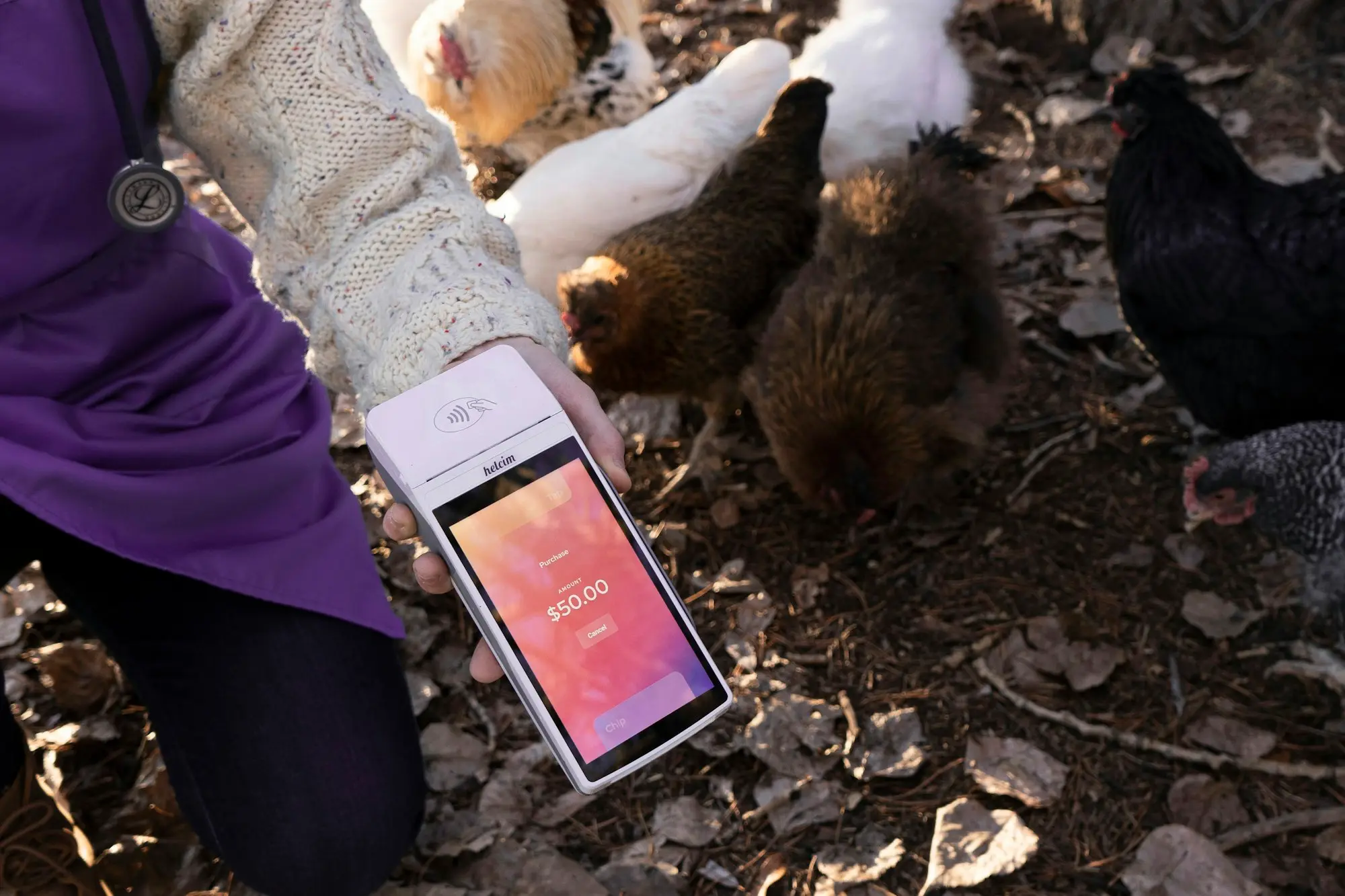 A business owner holding a phone while making a quick funding enquiry